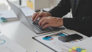 Financial analysts analyze business financial reports on a digital tablet planning investment project during a discussion at a meeting of corporate showing the results of their successful teamwork. video
