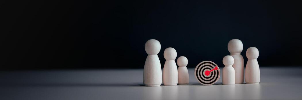 concept of business achievement objective target, teamwork for success. target board icon and wooden doll icon with copy space for business design photo