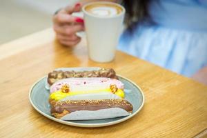 Young woman sitting at the table in cafe photo