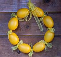 easter wreath decoration on a wooden wall photo