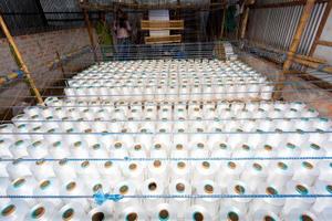 Bangladesh August 05, 2019 Traditional handmade system manual loom machine yarn and cloth factory indoor views at Narsingdi, Bangladesh. photo