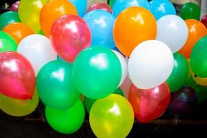 A lot of colorful balloons close-up views. Balloons of many colours. Colorful balloons background. photo