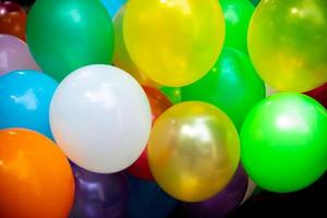 A lot of colorful balloons close-up views. Balloons of many colours. Colorful balloons background. photo