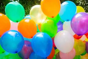 The colored gas-filled balloons attached to the yarn are flying. photo