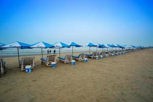 The early morning sky and sun view of the longest sea beach Cox's Bazar, Chattagram. photo