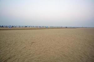 The early morning empty view of the longest sandy sea beach Cox's Bazar. photo