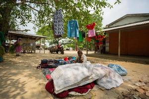 Bangladesh May 19, 2019 A Rural village Businessman selling cloth and products to hang up on the tree trunk, Meherpur, Bangladesh. photo