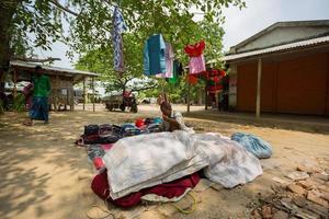 Bangladesh May 19, 2019 A Rural village Businessman selling cloth and products to hang up on the tree trunk, Meherpur, Bangladesh. photo