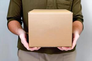 Male Hand Holding A Corrugated Parcel Box, photo