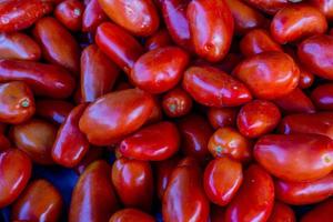 ripe red spanish healthy tomatoes on a market stand photo