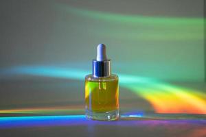 Face oil in front of rainbow photo