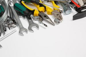 Set of tools for repair in a case on a white background. Assorted work or construction tools. Wrenches, Pliers, screwdriver. Top view photo