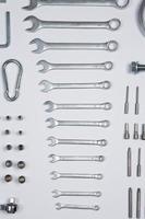 Set of tools for repair in a case on a white background. Assorted work or construction tools. Wrenches, Pliers, screwdriver. Top view photo