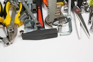 Set of tools for repair in a case on a white background. Assorted work or construction tools. Wrenches, Pliers, screwdriver. Top view photo