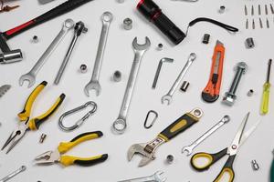 Set of tools for repair in a case on a white background. Assorted work or construction tools. Wrenches, Pliers, screwdriver. Top view photo