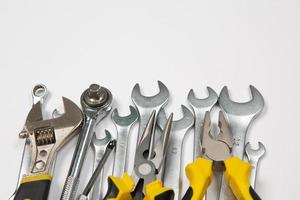 Set of tools for repair in a case on a white background. Assorted work or construction tools. Wrenches, Pliers, screwdriver. Top view photo