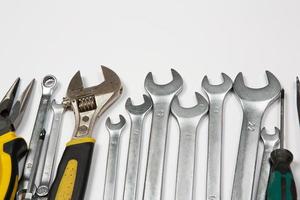 Set of tools for repair in a case on a white background. Assorted work or construction tools. Wrenches, Pliers, screwdriver. Top view photo