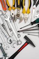 Set of tools for repair in a case on a white background. Assorted work or construction tools. Wrenches, Pliers, screwdriver. Top view photo