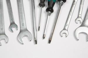 Set of tools for repair in a case on a white background. Assorted work or construction tools. Wrenches, Pliers, screwdriver. Top view photo