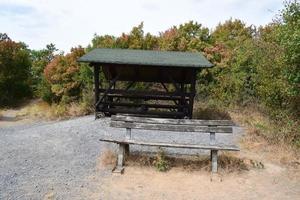 Hut and Benches at a Trail photo