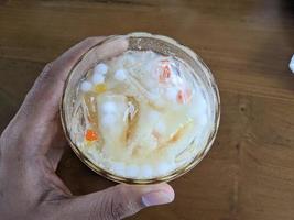 Yakult mango ice with fresh milk and little pulpy. The photo is suitable to use for coffee shop background, menu poster and coffee content media.