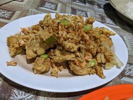 Chicken salted eggs crispy traditional food of Semarang. The photo is suitable to use for traditional food background, poster and food content.