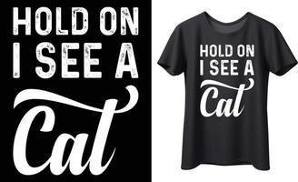 Hold on i see a cat typography vector t-shirt design. Perfect for all print items and bags, poster, mug, template. Handwritten vector illustration. Isolated on black background.