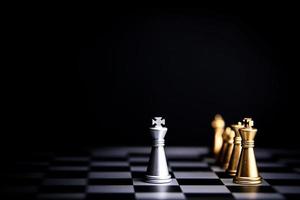 Strategic planning and leadership. Chess game on black and white background. Concept of business showing leadership, decision making, brainstorming with copy space for text. photo