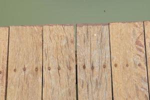 wooden floor walkway in pond photo