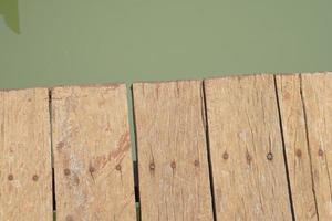 wooden floor walkway in pond photo