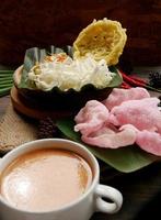 Selective focus of Asinan Betawi. The vegetable asinan of the Betawi people from Jakarta is preserved Chinese cabbage, cabbage, bean sprouts, tofu, and lettuce served with peanut sauce and krupuk photo