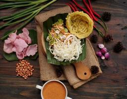 Selective focus of Asinan Betawi. The vegetable asinan of the Betawi people from Jakarta is preserved Chinese cabbage, cabbage, bean sprouts, tofu, and lettuce served with peanut sauce and krupuk photo