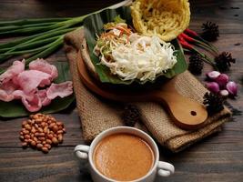 Selective focus of Asinan Betawi. The vegetable asinan of the Betawi people from Jakarta is preserved Chinese cabbage, cabbage, bean sprouts, tofu, and lettuce served with peanut sauce and krupuk photo