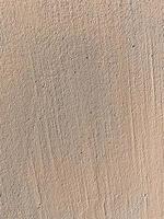 close up of beige plaster on wall photo