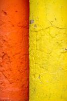 Red and yellow color combination old Textured damage wall photo