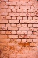 Red, Orange, yellow and blue color combination old Textured damage wall with Colorful Bricks. photo