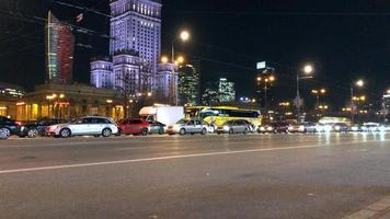 Night city traffic in the center of Warsaw near the Palace of Science and Culture, Poland video