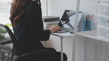 Financial analysts analyze business financial reports on a digital tablet planning investment project during a discussion at a meeting of corporate showing the results of their successful teamwork. video