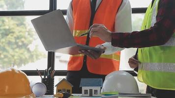 Construction and structure concept of Engineer or architect meeting for project working with partner and engineering tools on model building and blueprint in working site, contract for both companies. video