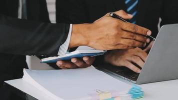 Financial analysts analyze business financial reports on a digital tablet planning investment project during a discussion at a meeting of corporate showing the results of their successful teamwork. video