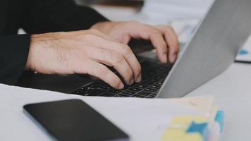 Financial analysts analyze business financial reports on a digital tablet planning investment project during a discussion at a meeting of corporate showing the results of their successful teamwork. video