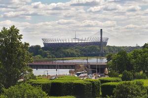 l summer view of the Warsaw National Stadium and the flowing Vistula River photo