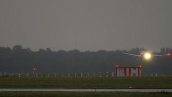 DUSSELDORF, GERMANY JULY 24, 2017 - SunExpress Boeing 737 TC SNV flight SXS8D from Ankara ESB taxiing at rain early morning, other Sunexpress Boeing 737 landing at background. video