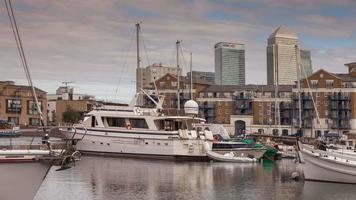 timelapse of the financial skyscrapers of london docklands, canary wharf in the distance, shot from the limehouse wharf and harbour video