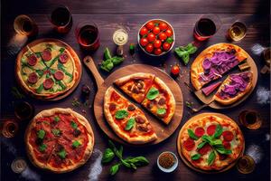 illustration of pizza party dinner. Flat-lay of various kinds of Italian pizza, salad and red wine in glasses over rustic wooden table, top view, wide composition photo