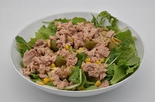 Fresh summer salad with tuna, olives, mais and lattuce. photo