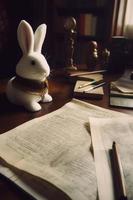 a cute fluffy bunny grumpily working on her trip itinerary, Generate Ai photo