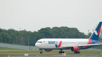 PHUKET, THAILAND NOVEMBER 26, 2017 - Azur Air Boeing 767 VQ BUP taxiing after landing at Phuket International airport video