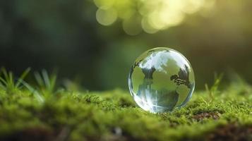 a glass globe concept day earth save the world save environment the world is in the grass of the green bokeh background, generat ai photo