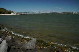 The York river and beach in Yorktown Virginia overlooking the Coleman Bridge and the Chesapeake Bay photo